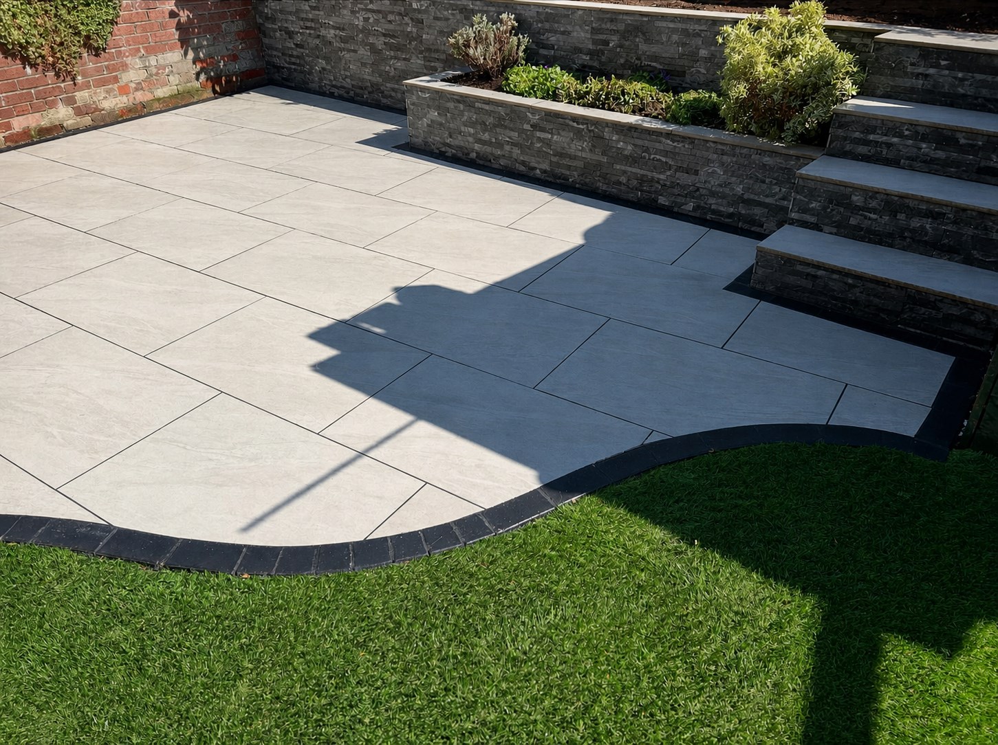 Completed paved patio and lawn by RB Landscapes